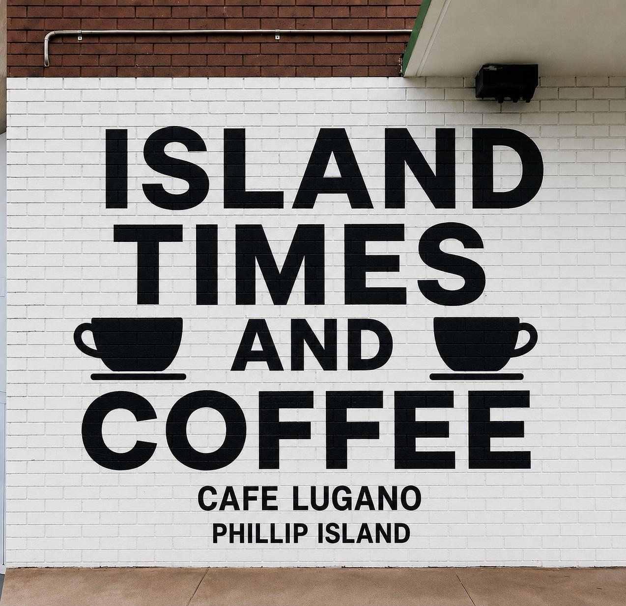 Island Times and Coffee mural on white brick wall — Cafe Lugano, Phillip Island